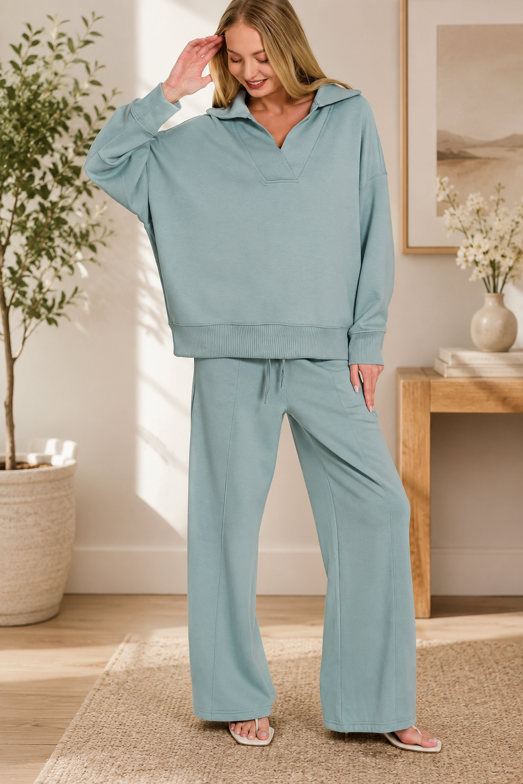 Woman wearing a blue grey Zenana scuba knit two-piece lounge set with a relaxed collared pullover and wide-leg center seam pants. Front View