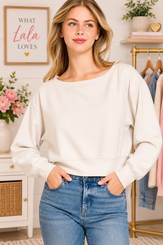 Woman wearing a bone scuba cropped boat neck pullover sweatshirt by Zenana. Front View
