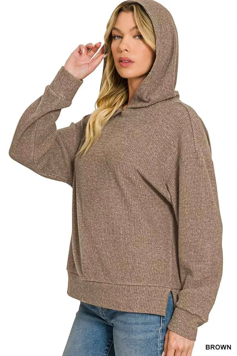 Woman wearing a brown brushed ribbed Hacci hoodie with long sleeves and a relaxed fit by Zenana. Side View