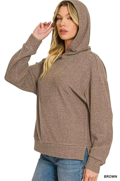 Woman wearing a brown brushed ribbed Hacci hoodie with long sleeves and a relaxed fit by Zenana. Side View