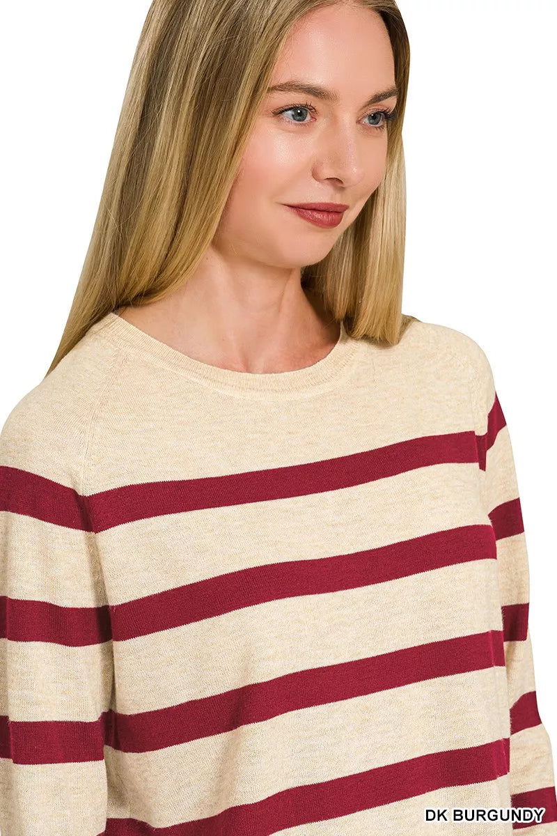 Woman wearing a burgundy striped lightweight wool blend crew neck sweater by Zenana.