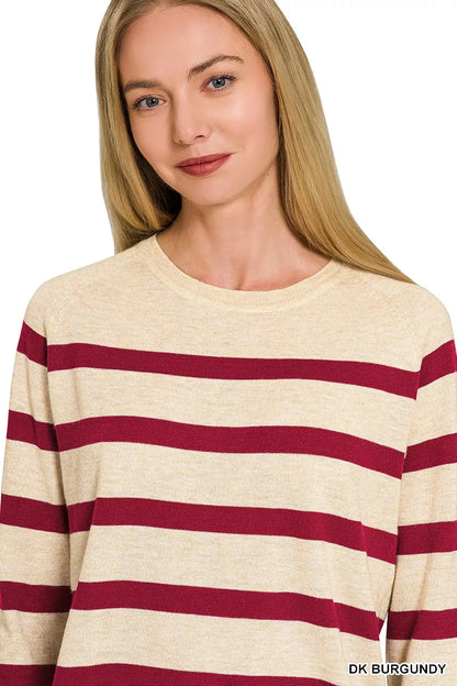 Woman wearing a burgundy striped lightweight wool blend crew neck sweater by Zenana. Close View
