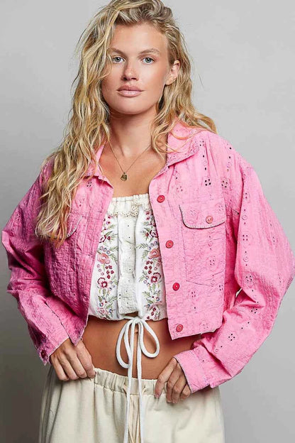 Woman wearing a candy pink eyelet cropped cotton jacket by POL, featuring textured fabric, button-front styling, and feminine boutique details. Front view 2