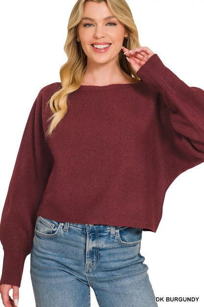 Woman wearing a dark burgundy boat neck sweater with oversized balloon sleeves, ribbed cuffs, and relaxed fit styled with blue denim jeans by Zenana. Front View 2