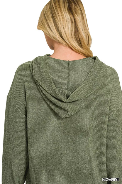 Woman wearing a dark olive brushed ribbed Hacci knit hoodie with long sleeves and a relaxed fit by Zenana. Back View 2