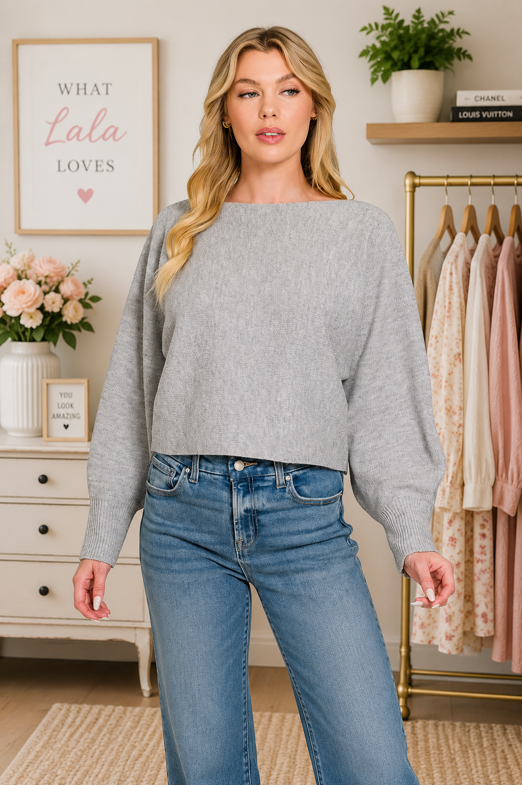 Woman wearing a heather grey boat neck balloon sleeve knit sweater by Zenana. Front View