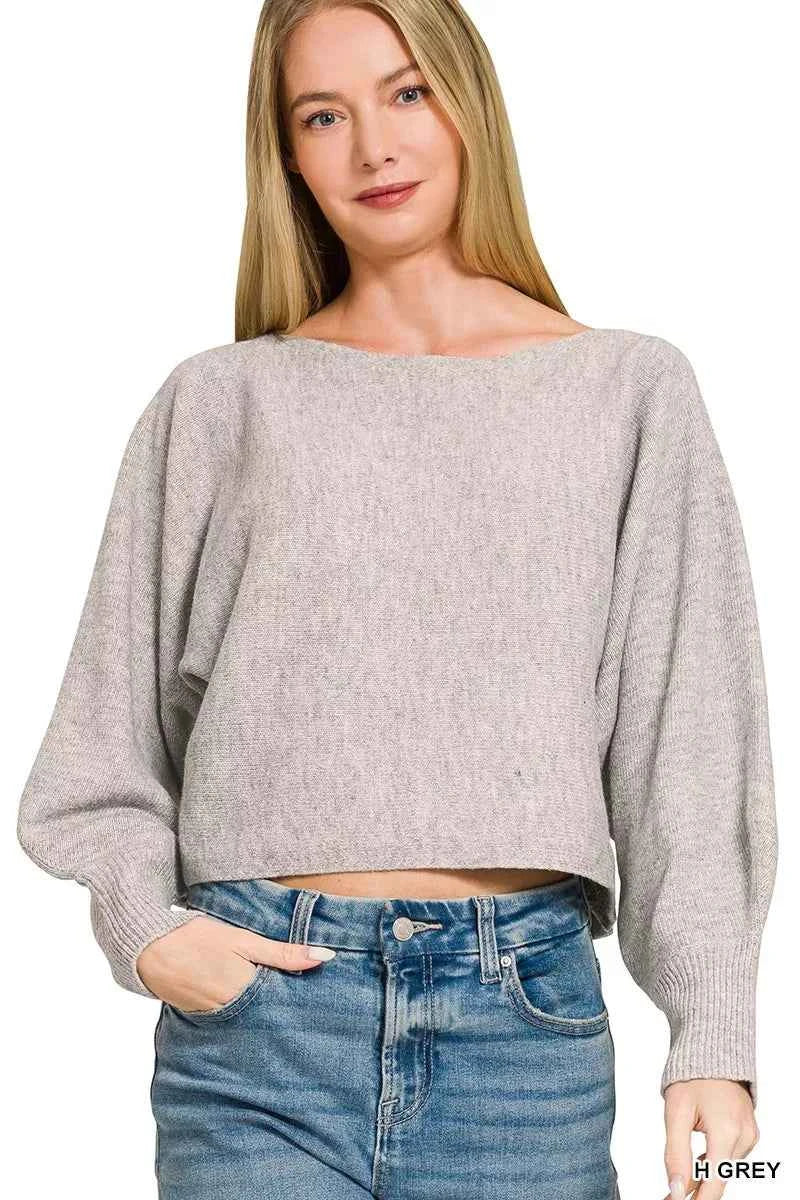 Woman wearing a heather grey boat neck balloon sleeve knit sweater by Zenana. Front View 2