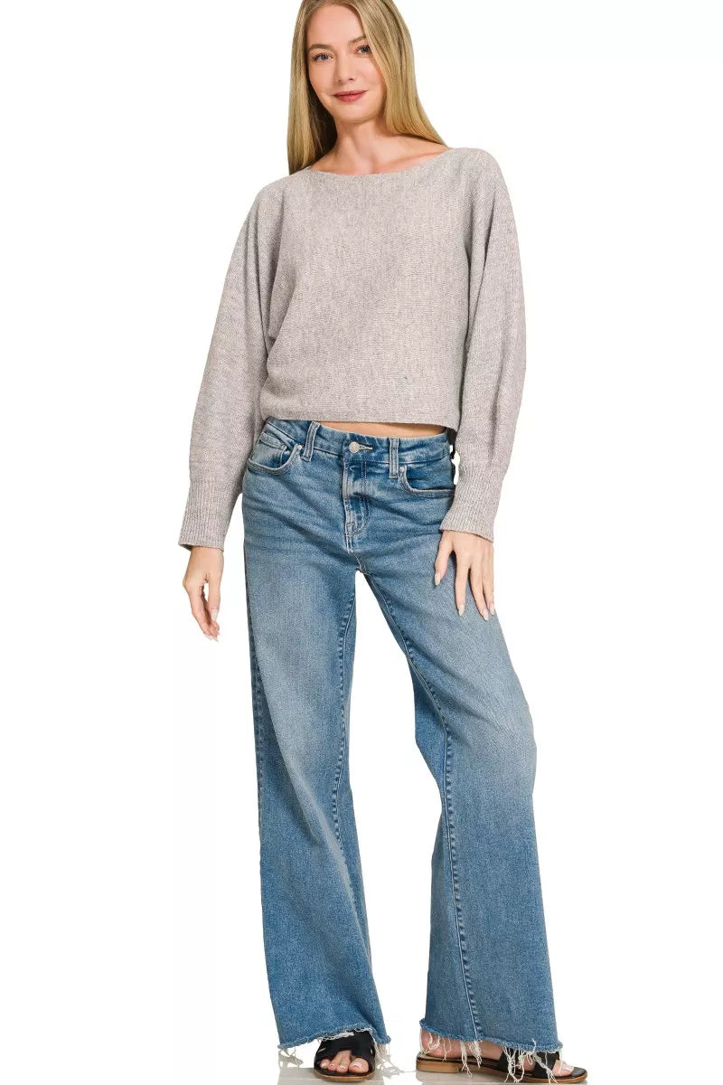 Woman wearing a heather grey boat neck balloon sleeve knit sweater by Zenana. Full View