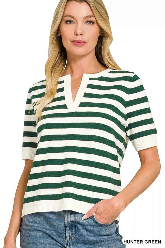 Woman wearing a hunter green and ivory striped split neck short sleeve sweater top by Zenana paired with wide leg denim jeans. Front View