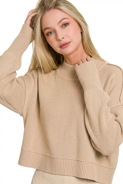 Woman wearing a light mocha oversized cropped knit sweater with side slits by Zenana. Close View
