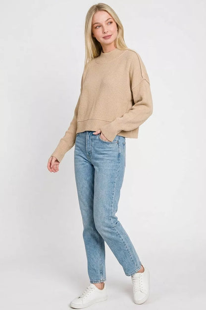 Woman wearing a light mocha oversized cropped knit sweater with side slits by Zenana. Full View