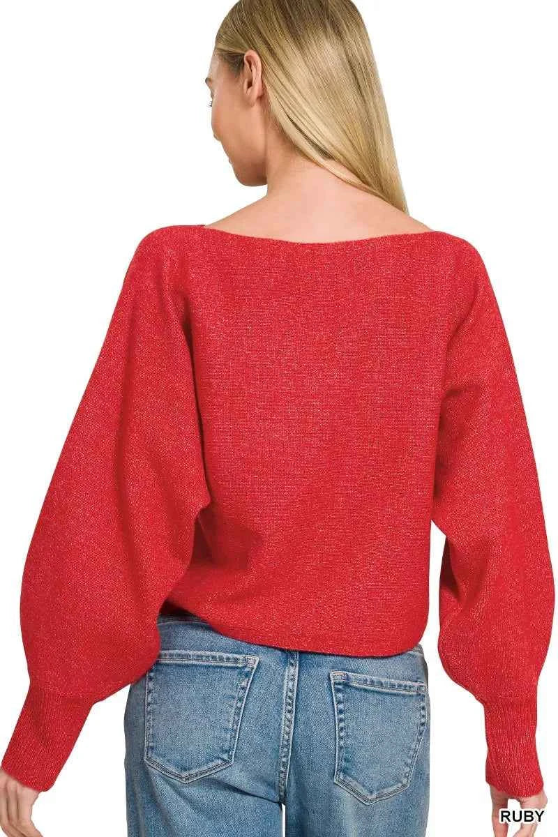 Woman wearing a ruby red boat neck balloon sleeve knit sweater by Zenana with relaxed fit and ribbed cuffs. Back View