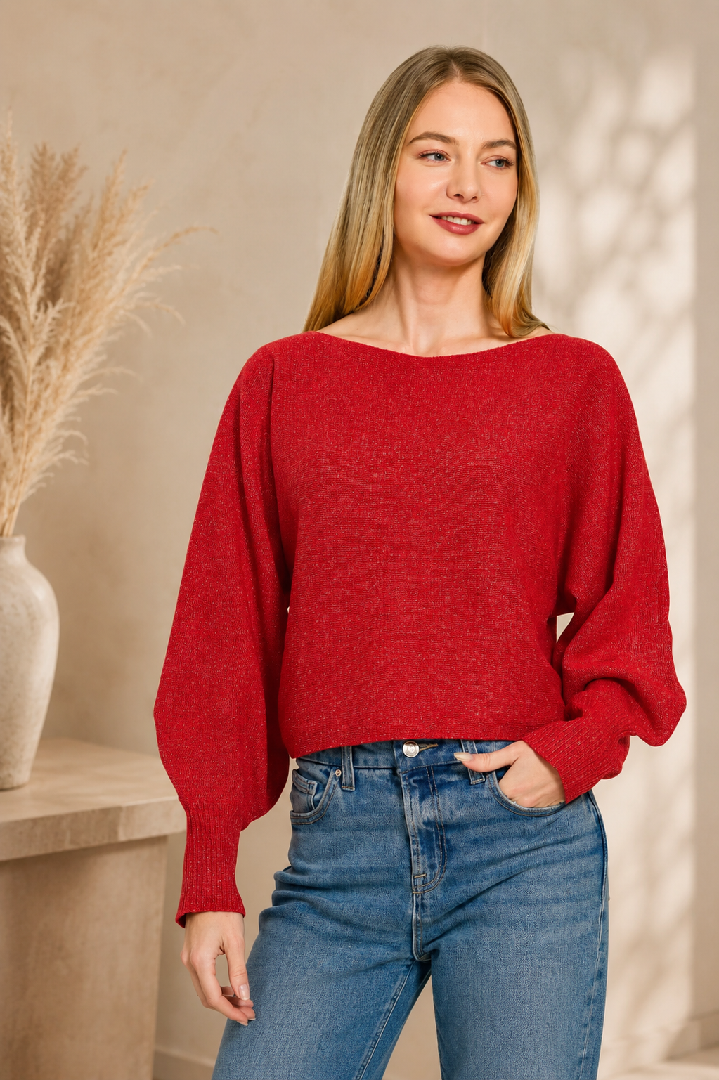 Woman wearing a ruby red boat neck balloon sleeve knit sweater by Zenana with relaxed fit and ribbed cuffs. Front View