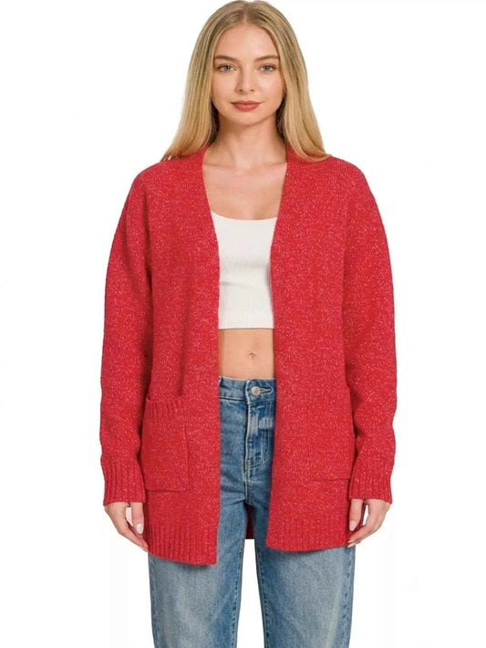 Woman wearing a ruby red open front knit cardigan sweater with front pockets by Zenana. Front View