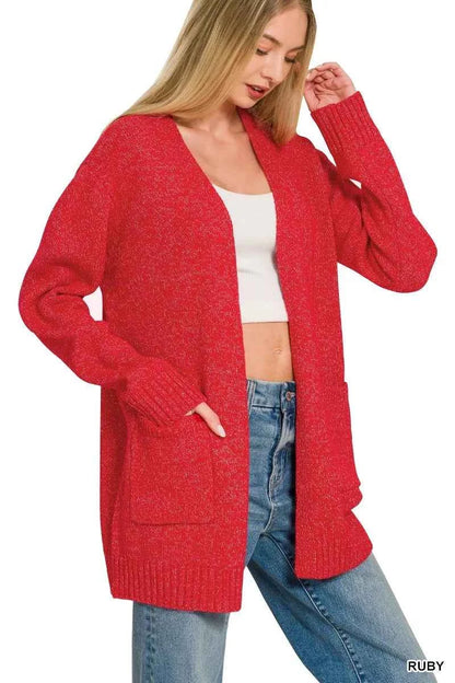 Woman wearing a ruby red open front knit cardigan sweater with front pockets by Zenana. Side view 2