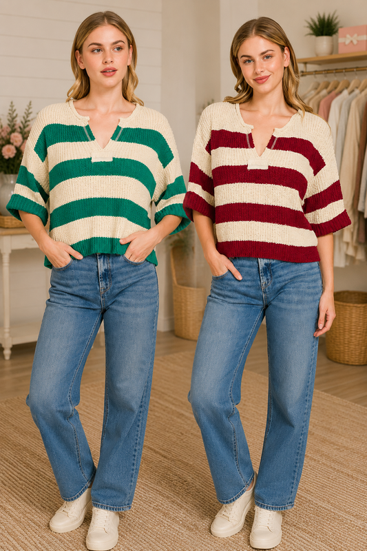 Woman wearing a striped cropped knit sweater with a split V-neck and relaxed fit paired with wide-leg denim.