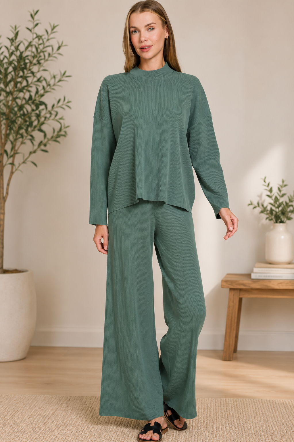 Woman wearing an Ash Jade ribbed two-piece sweater and wide leg pants set by Zenana featuring a relaxed fit and soft viscose knit fabric. Full Front View