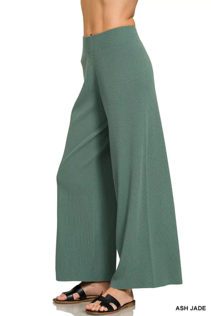 Woman wearing an Ash Jade ribbed two-piece sweater and wide leg pants set by Zenana featuring a relaxed fit and soft viscose knit fabric. Pant Side View