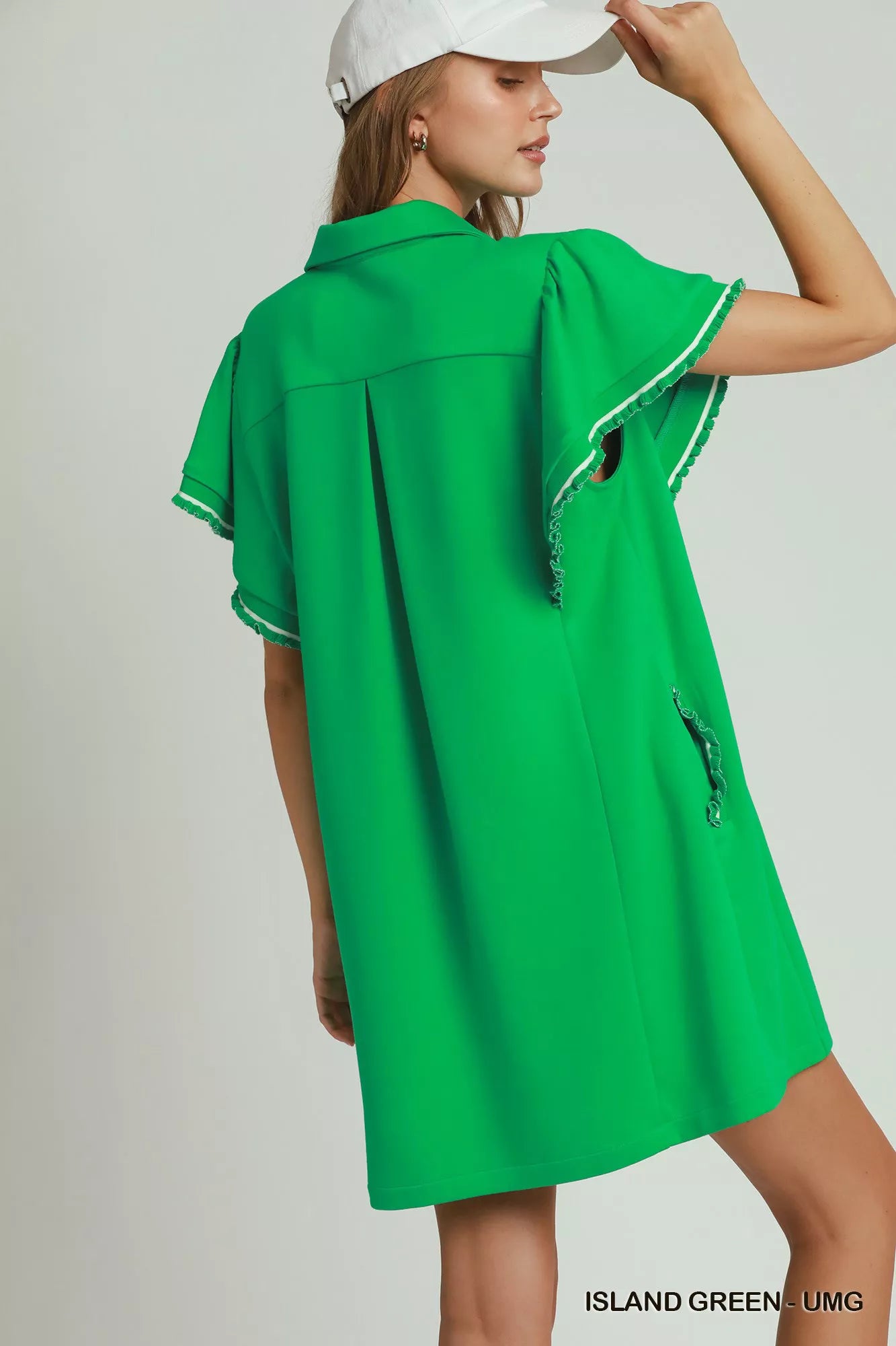 Woman wearing an island green LuxeKnit half-zip dress with butterfly sleeves and pockets by Umgee Back View
