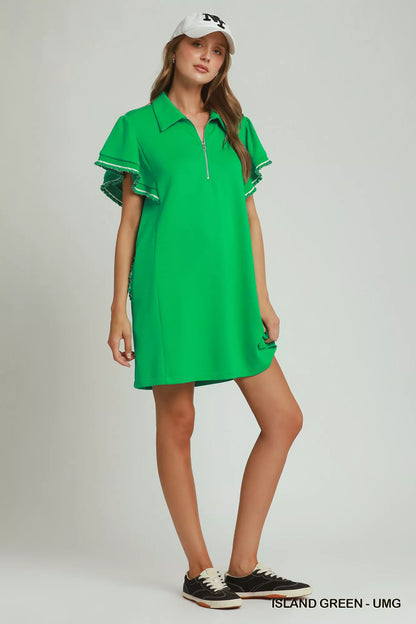 Woman wearing an island green LuxeKnit half-zip dress with butterfly sleeves and pockets by Umgee Full View