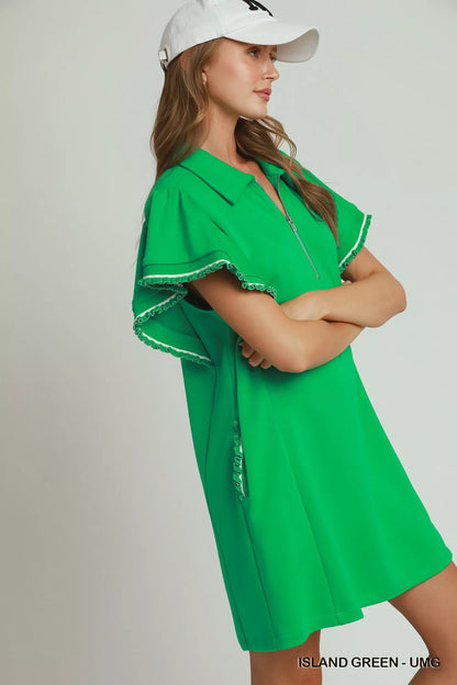 Woman wearing an island green LuxeKnit half-zip dress with butterfly sleeves and pockets by Umgee Side View