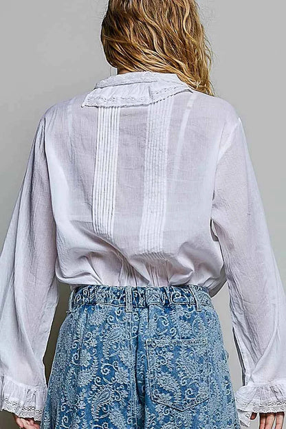 Woman wearing an ivory lace trim pintuck button-down blouse from POL, featuring romantic lace details, pleated front accents, and a relaxed fit. Back View