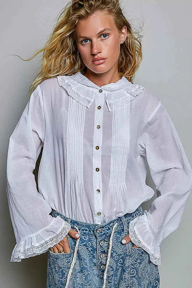 Woman wearing an ivory lace trim pintuck button-down blouse from POL, featuring romantic lace details, pleated front accents, and a relaxed fit. Front view 3