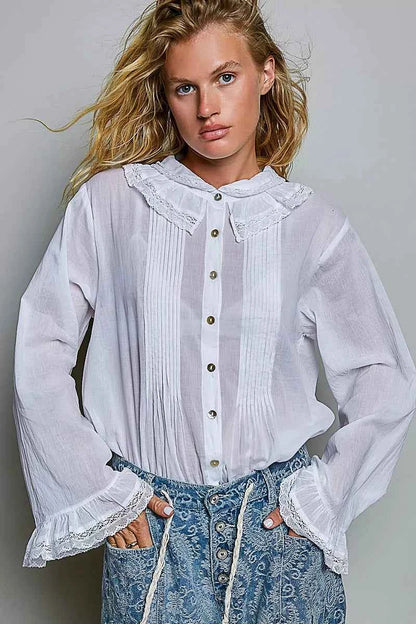 Woman wearing an ivory lace trim pintuck button-down blouse from POL, featuring romantic lace details, pleated front accents, and a relaxed fit. Front view 3