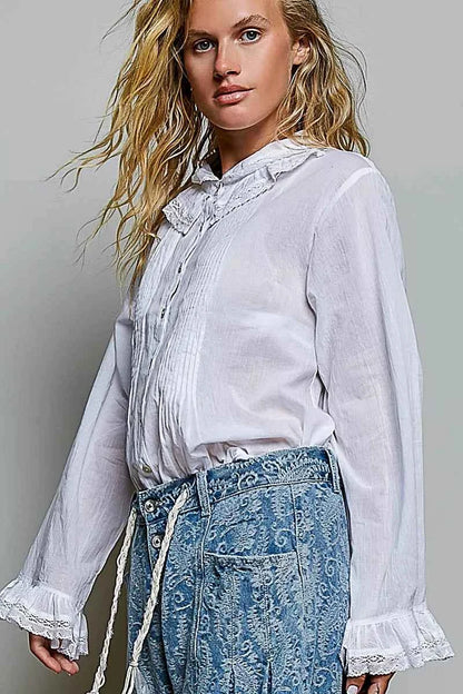 Woman wearing an ivory lace trim pintuck button-down blouse from POL, featuring romantic lace details, pleated front accents, and a relaxed fit. Side View