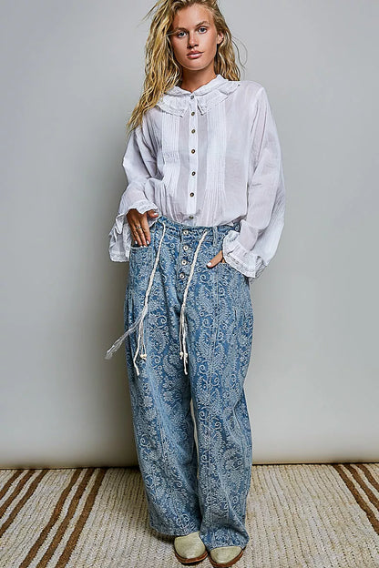 Woman wearing an ivory lace trim pintuck button-down blouse from POL, featuring romantic lace details, pleated front accents, and a relaxed fit. full view
