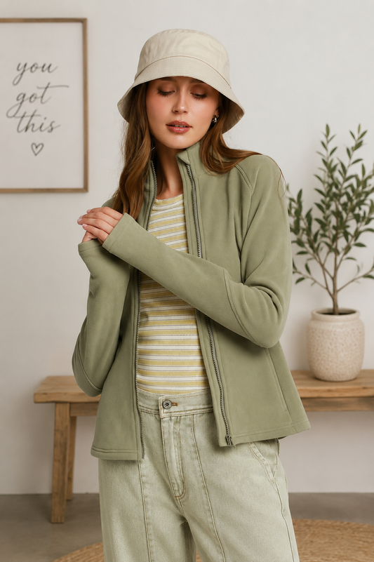 Woman wearing an olive soft fleece full zip jacket with side pockets by Umgee. Front View