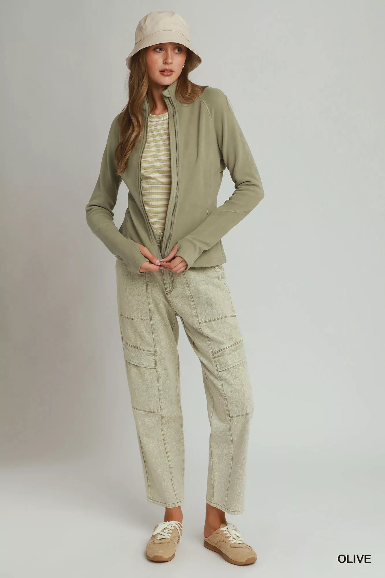 Woman wearing an olive soft fleece full zip jacket with side pockets by Umgee. Full View