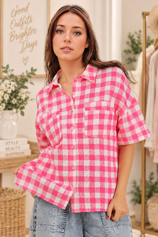 Woman wearing an oversized checkered button-down woven shirt with patch pockets and short sleeves front view from VERY J