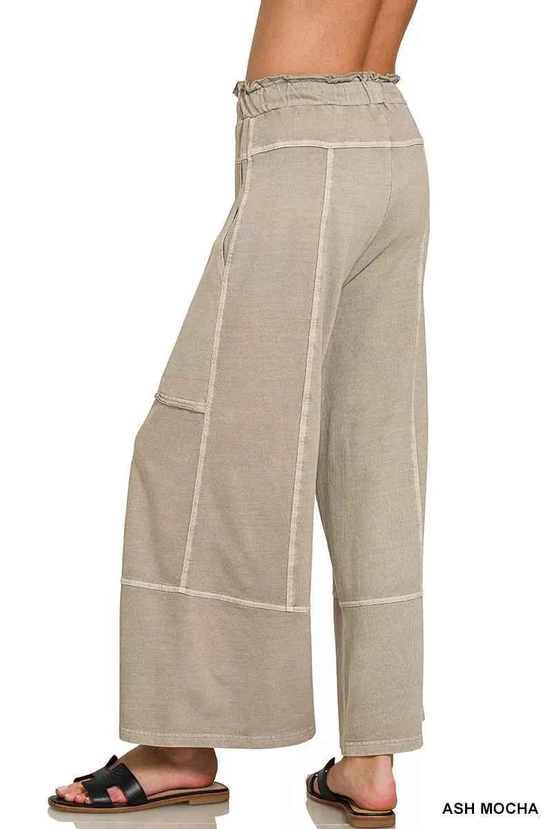 Woman wearing ash mocha washed French terry wide leg pants with exposed seam details, drawstring waist, and relaxed casual fit by Zenana. Back view