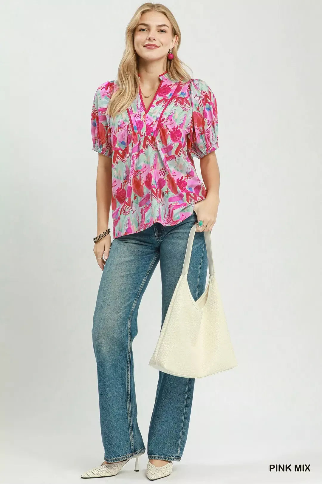 Women's Umgee pink mix abstract print blouse featuring colorful artistic patterns, puff sleeves, ruched details, and a relaxed cotton silhouette. Full view