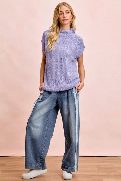 Women's washed denim jeans with lace side panel detailing, relaxed fit silhouette, and vintage-inspired finish by BiBi.