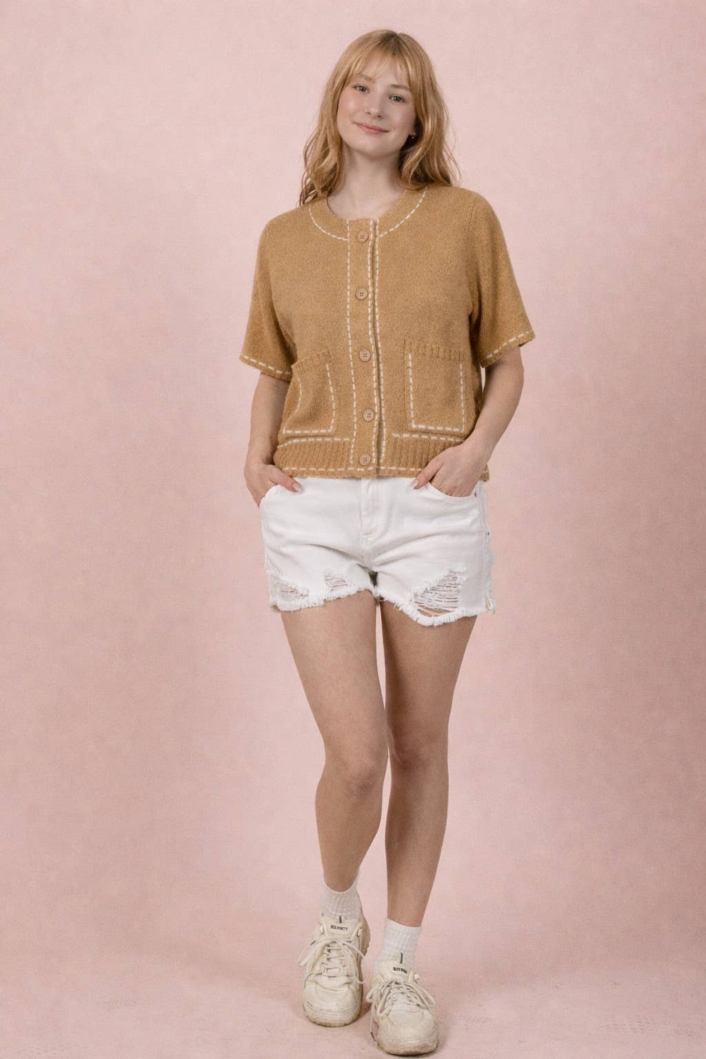 Stitch detail button-down knit cardigan top with short sleeves, front pockets, ribbed hem, and round neckline